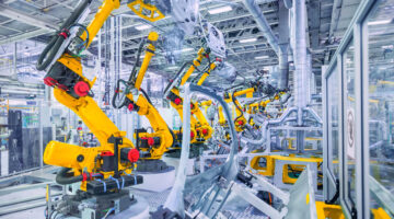 orange Roboterarme in einer Automobil Produktion
